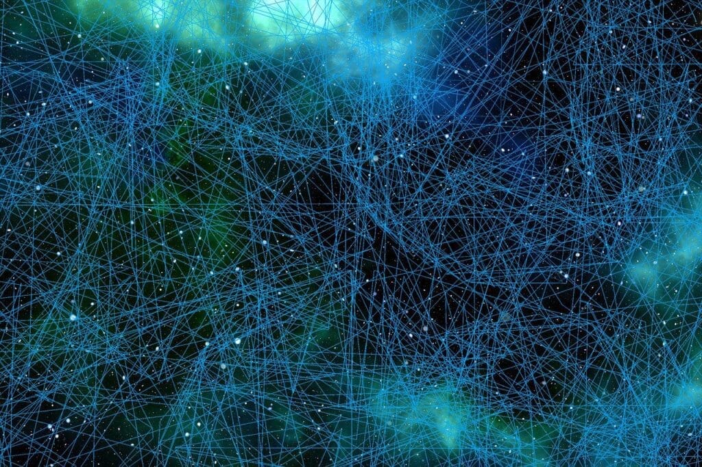 Intricate network of glowing blue and green lines and dots against a dark background